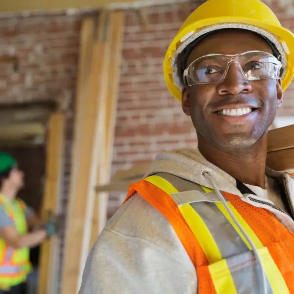 Construction worker wearing safety glasses.