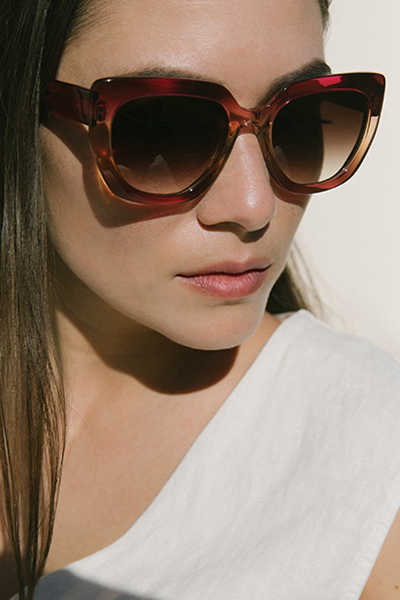 Woman models Barton AKAHI Flirtini Gradient sunglasses.